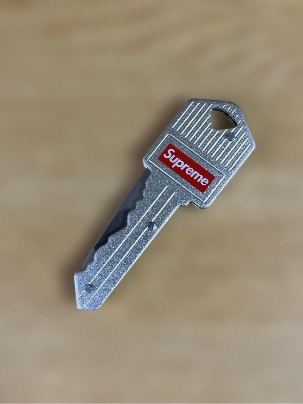 Supreme Silver Key-Shaped Phone Charm with Red Logo